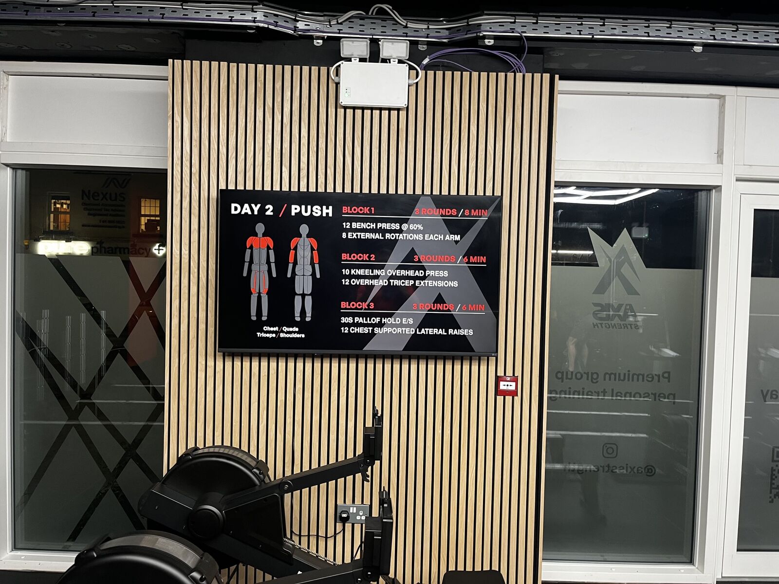 Day 2 push workout on the Axis studio screen, with the mark set large behind the three training blocks