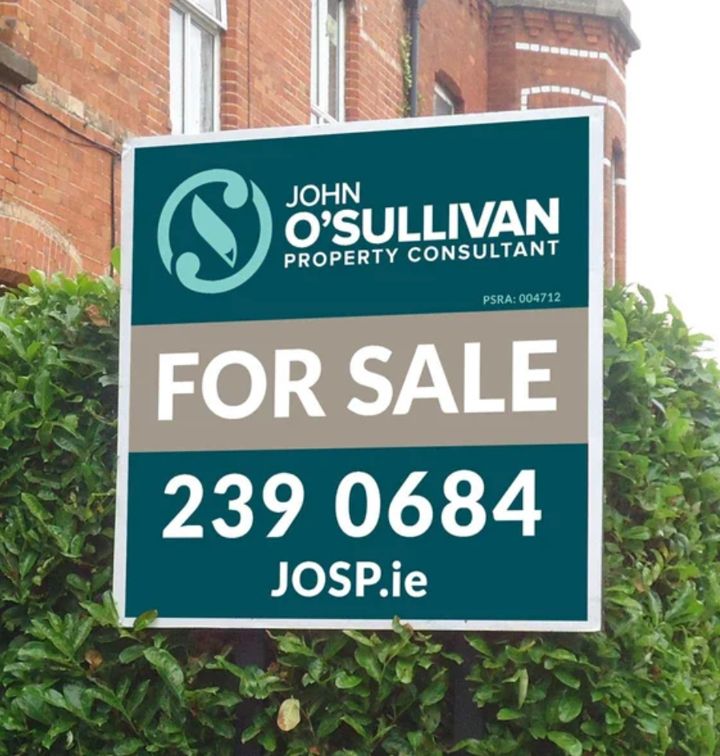 John O'Sullivan For Sale board outside a red-brick house