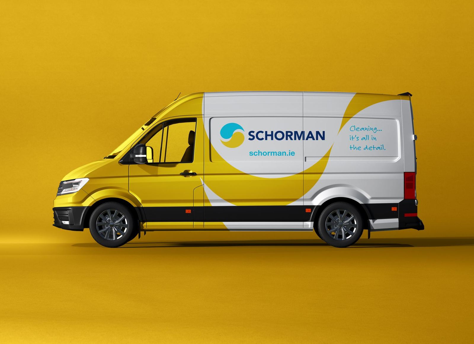 Yellow Schorman van with the blue and yellow logo