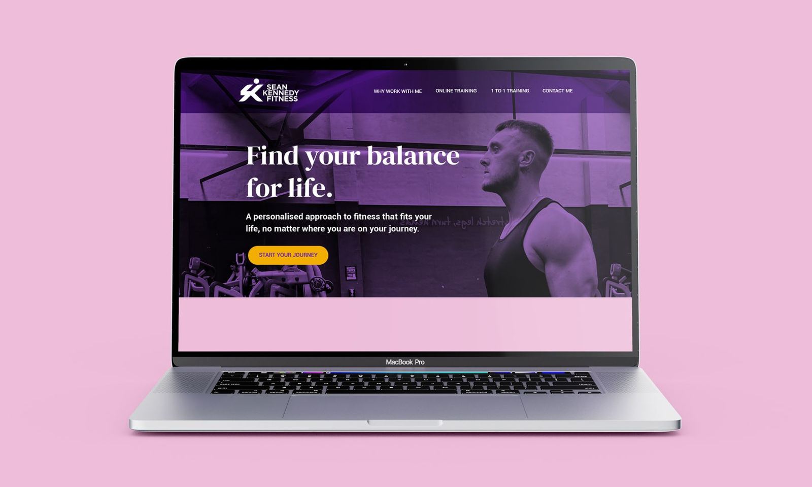 Laptop showing the Sean Kennedy Fitness website headline Find your balance for life
